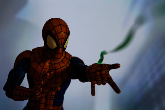 NEW YORK USA - AUGUST 2 2020: Scene with Marvel comic superhero Spiderman shooting a web - Hasbro Marvel Legends figure