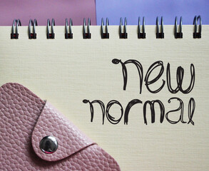 New normal words in copybook and wallet. Word after Coronavirus. social and business Concept.