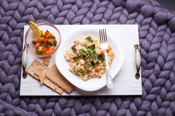A plate of food with rice and vegetables