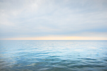 Cloudy blue sky reflecting in the water. Natural mirror. Baltic sea, Ruhnu island, Estonia. Idyllic...
