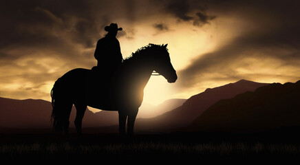 Cowboy on a horse at sunset