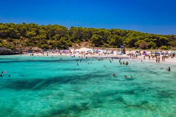 CALA MONDRAGO, Majorka, Spain, 24 July 2020 - People enjoy the beach in summer, Parque Natural de Mondrago. Santanyi. Malorca. Spain