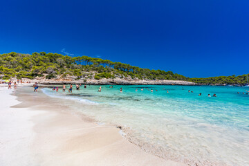 CALA MONDRAGO, Majorka, Spain, 24 July 2020 - People enjoy the beach in summer, Parque Natural de Mondrago. Santanyi. Malorca. Spain