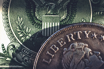 Close up US coin and one Dollar bill as symbol of wealth, and business.