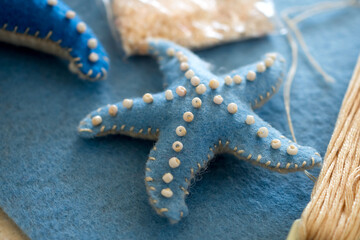 Fototapeta na wymiar DIY instruction. Step by step tutorial. Making Summer decor - wreath of rope with sea stars made of felt. Craft tools and supplies