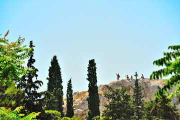 Tourists with cameras on Areospagos Hill(Hill of Ares) in Athens, Greece.