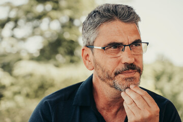 Adult man thinking outside.