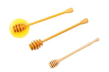 Carving wooden honey dipper spoon isolated on white background.