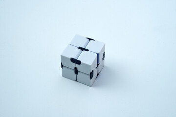A white infinity cube on a white isolate. Antistress toy.