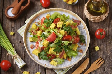 Cherry tomato salad, lettuce, with fried bacon, corn croutons with olive oil and white balsamic.
