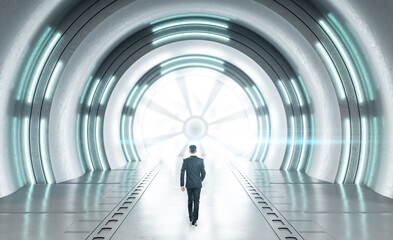 Fototapeta premium Businessman walking in futuristic concrete space ship interior