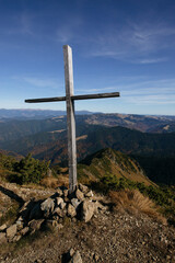Wooden cross in mountains