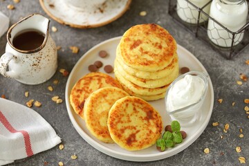 Homemade cheesecakes with sour cream. Homemade breakfast.