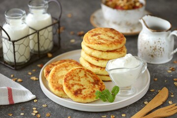 Homemade cheesecakes with sour cream. Homemade breakfast.
