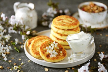 Homemade cheesecakes with sour cream. Homemade breakfast.