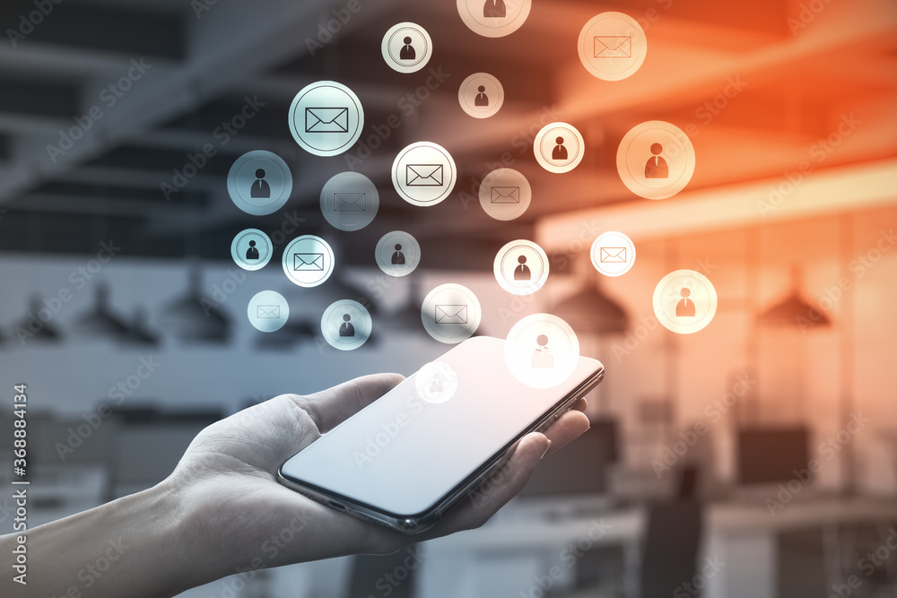 Poster hand holding cellphone with glowing email network interface.