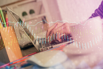 Double exposure of woman hands typing on computer and forex chart hologram drawing. Stock market invest concept.