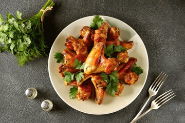 Grilled chicken wings with parsley.