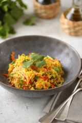 Couscous salad with radishes, cucumbers, carrots, cilantro, olive oil and wine vinegar. Healthly food.