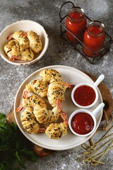 Tiger shrimp tails in Parma ham or jamon and puff pastry. Delicious homemade appetizer.