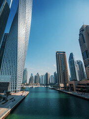 Fototapeta premium Dubai Marina, water canal, skyscrapers and high buildings, Dubai, United Arab Emirates.