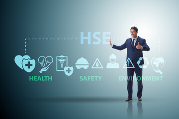 HSE concept for health safety environment with businessman