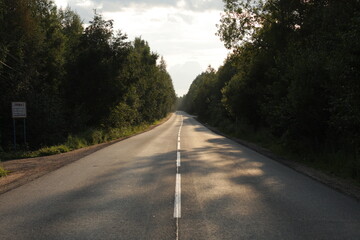 Fototapeta premium Highway through the forest in Russia