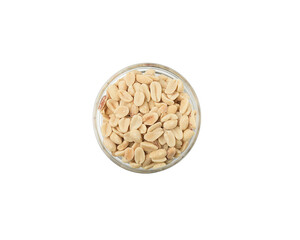 Salted roasted peanuts in a small round glass plate on a white background, isolate