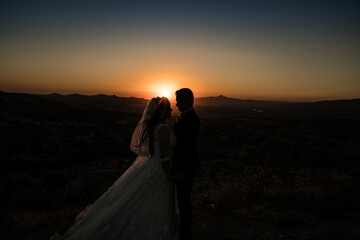 Fototapeta na wymiar Cappadocia sunset newly married couple
