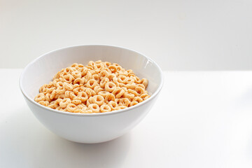 A plate of whole wheat cereal consisting of pulverized oats in the shape of a solid torus.