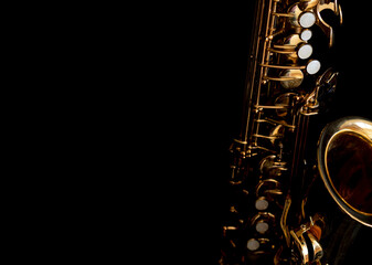 Alto saxophone against a black background