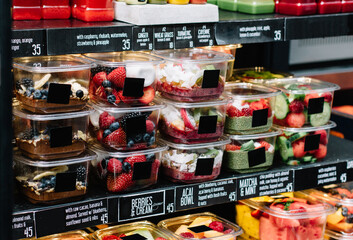 Containers of healthy items at a market in Copenhagen, Denmark.  Including Acai bowls, mousse, and...