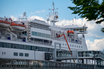 Naklejka premium Closeup of a large passenger RORO-ferry moored to the passenger terminal.
