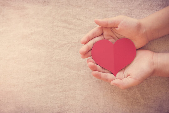 hands and red heart, health insurance, donation and charity concept