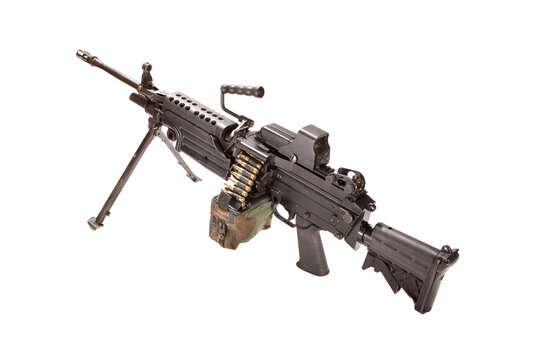 M249 SAW squad automatic weapon with a camouflage ammo pouch, shot in studio.