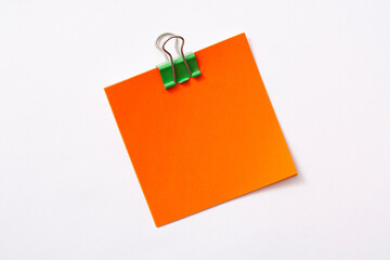 note paper and clip isolated on white background
