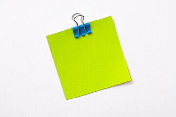 note paper and clip isolated on white background
