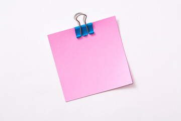 note paper and clip isolated on white background
