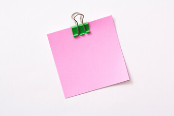 note paper and clip isolated on white background
