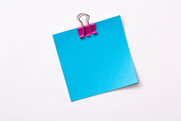 note paper and clip isolated on white background
