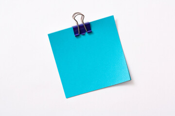 note paper and clip isolated on white background
