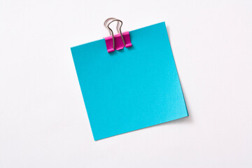 note paper and clip isolated on white background

