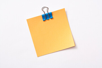 note paper and clip isolated on white background
