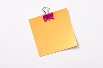 note paper and clip isolated on white background
