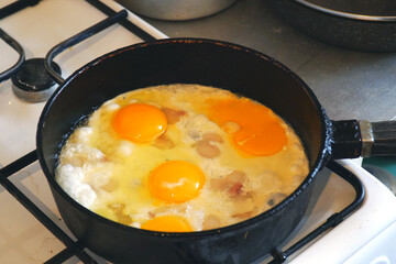 Eggs are fried in a pan. Cooking fried egg