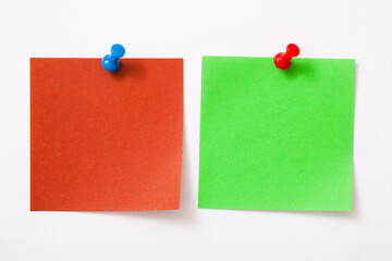 Note paper with pin on white background.
