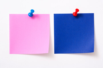 Note paper with pin on white background.
