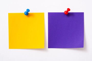 Note paper with pin on white background.
