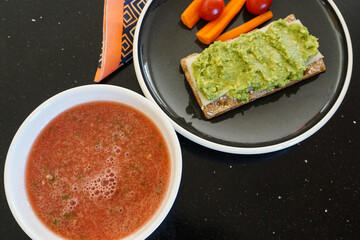 Chilled watermelon soup, avocado cracker and crudites, a healthy, refreshing summer lunch. 
