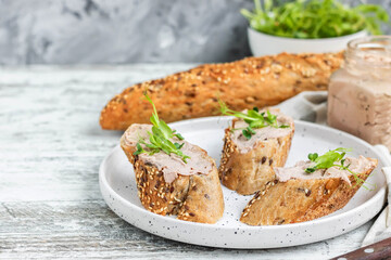Turkey liver pate on whole grain baguette with microgreens